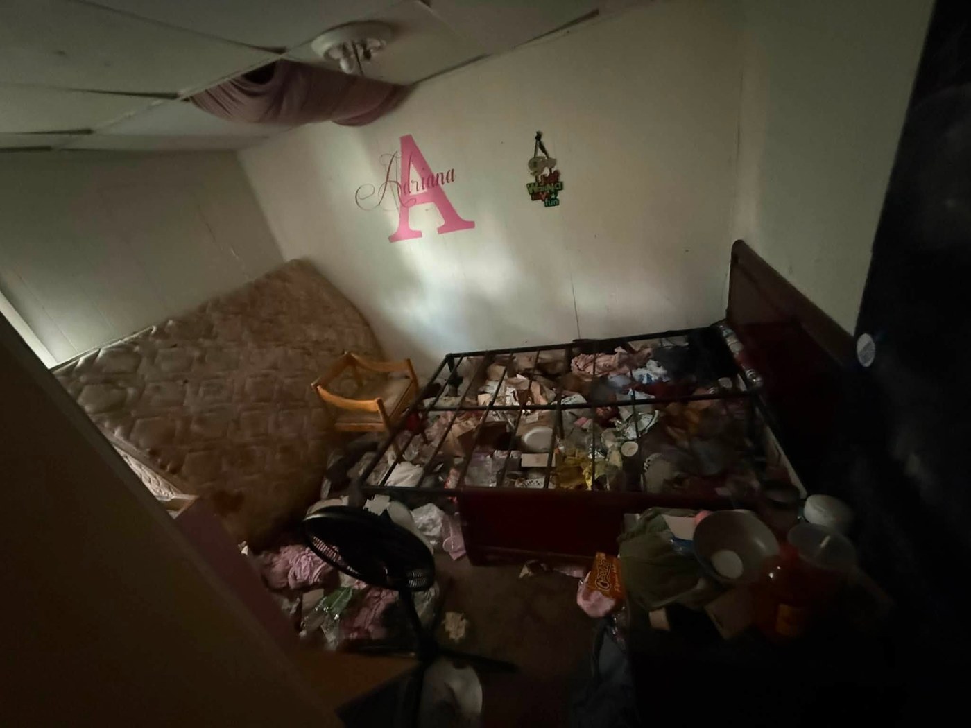Room with furniture and clutter before cleanout